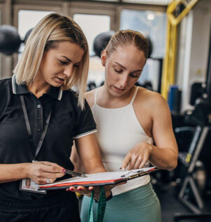 fitness instructor with a client