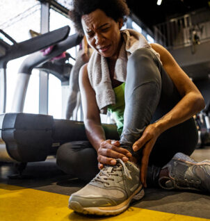 Woman with an ankle injury while training