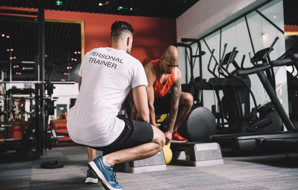 Personal trainer working with his client