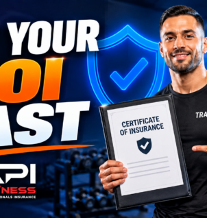 Personal trainer holding a certificate of insurance in a gym, illustrating how to obtain proof of coverage quickly.